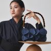 Blue-Rectangle-Wallet-Bag-with-Dark-Bamboo-Handle-with-model